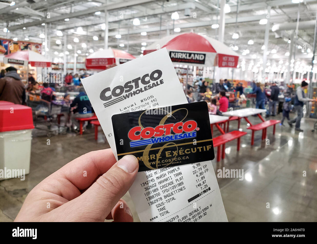 Montreal, Canada October 26, 2019 A hand holding a receipt and