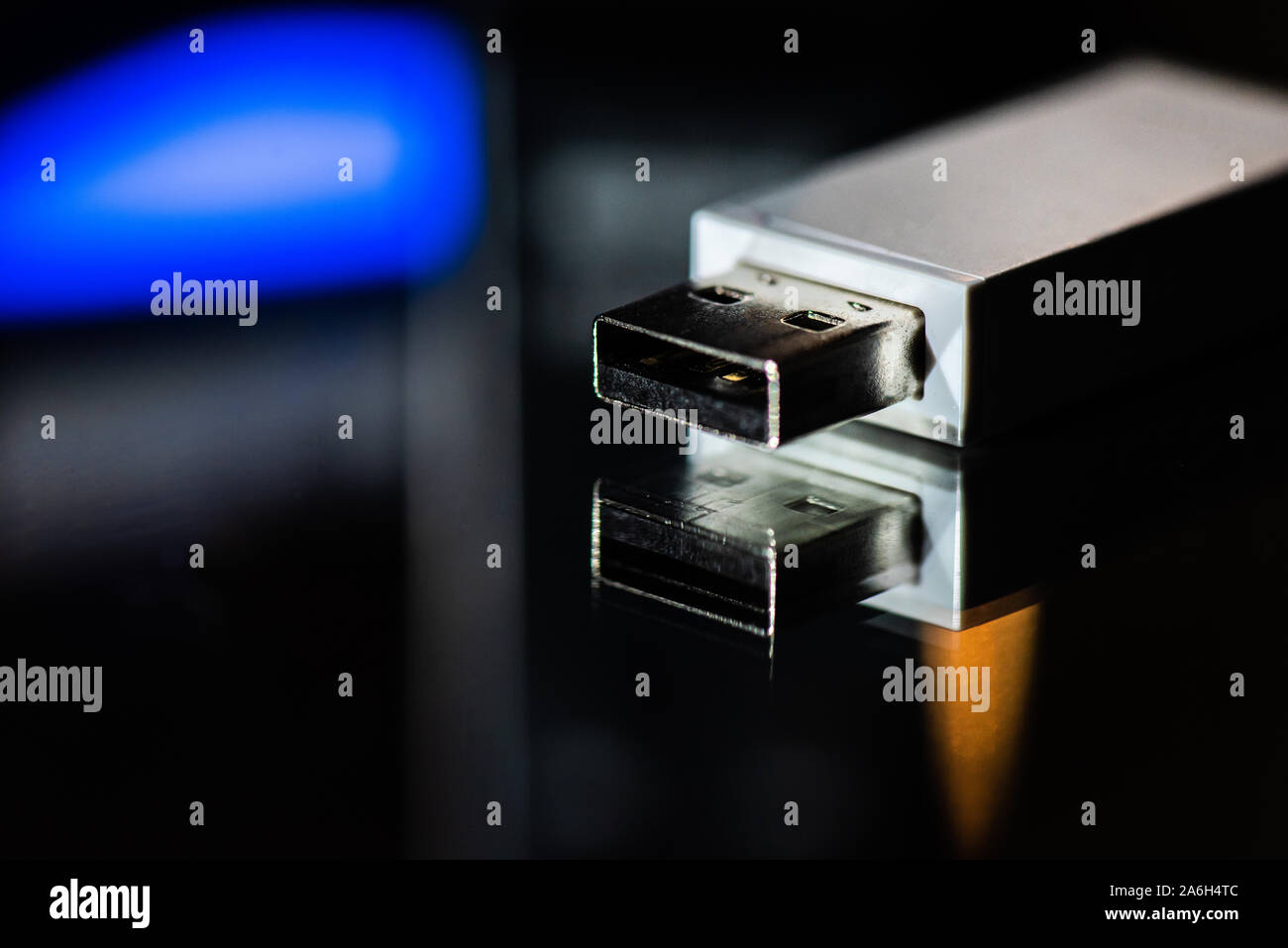USB memory stick, bluetooth connection adapter on a mirrored background