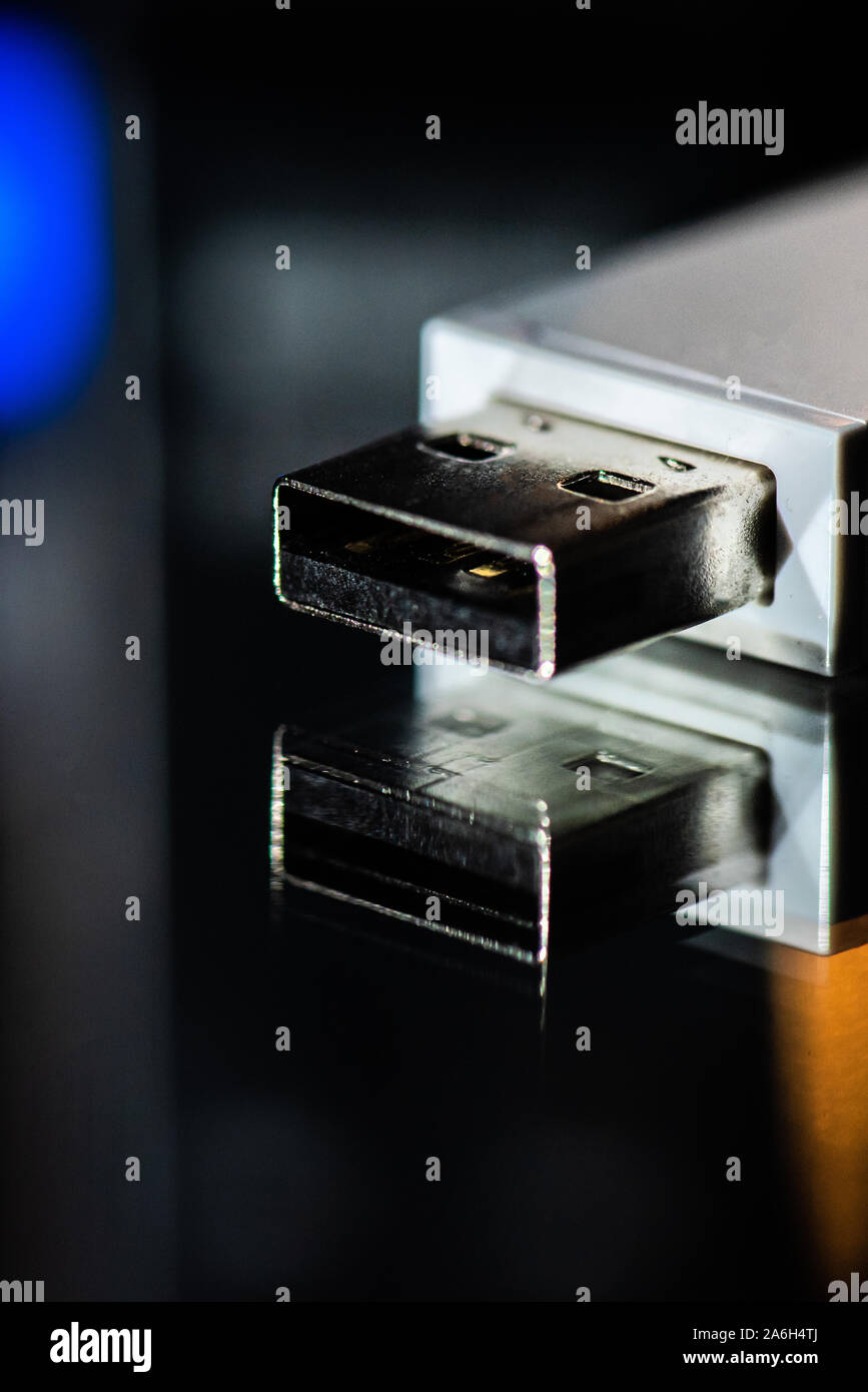 USB memory stick, bluetooth connection adapter on a mirrored background