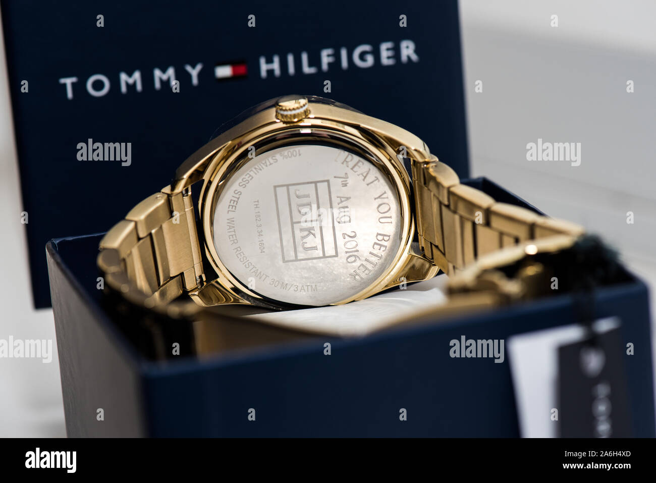 A Gold Tommy Hilfiger watch in it's presentation box, luxury, expensive  Stock Photo - Alamy
