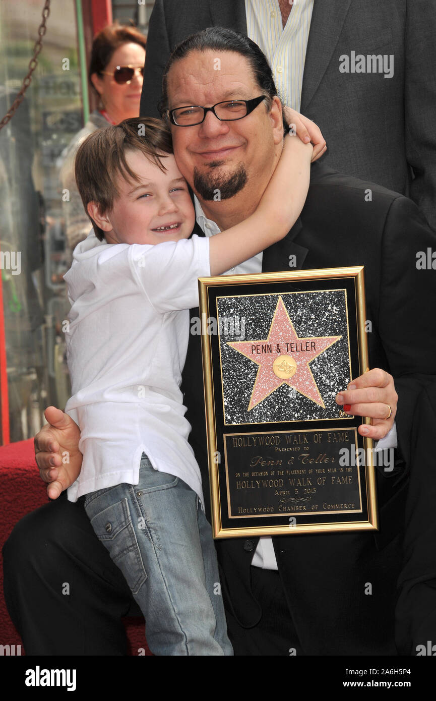 LOS ANGELES, CA. April 05, 2013: Magician Penn Jillette & son Zolten on  Hollywood Boulevard where