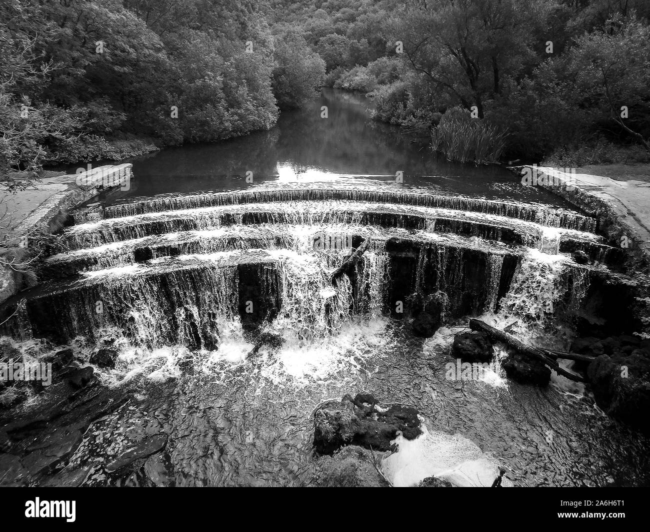 Aerial view of a little waterfall in Bakewell, the Derbyshire Peak
