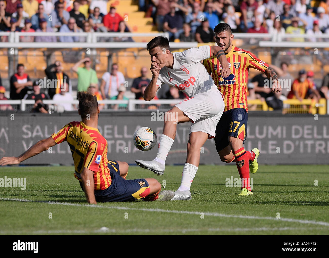 Lecce, Italy. 26th Oct, 2019. FC Juventus's Paulo Dybala (C) vies with Lecce's Panagiotis Tachtsidis (L) and Marco Calderoni during a Serie A soccer match between Lecce and FC Juventus in Lecce, Italy, Oct. 26, 2019. Credit: Federico Tardito/Xinhua/Alamy Live News Stock Photo