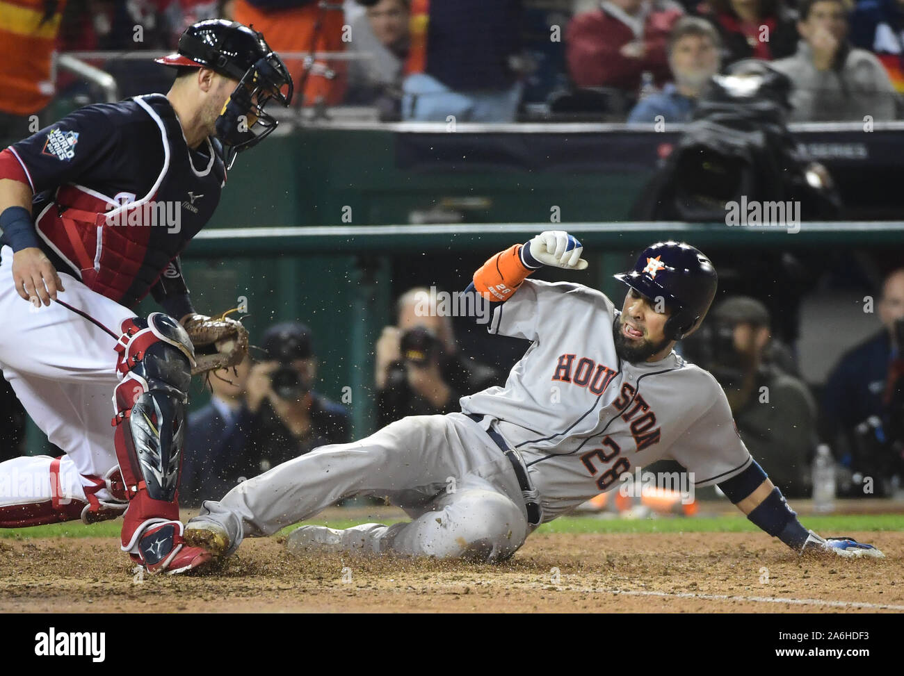 Washington, USA. 27th Oct, 2019. Washington Nationals catcher Yan Gomes tags out Houston Astros Robinson Chirinos to end the ninth inning in Game 4 of the 2019 World Series at Nationals Park in Washington, DC on Saturday, October 26, 2019. The Astros beat the Nationals 8-1 to even the series at two games apiece. Photo by Kevin Dietsch/UPI Credit: UPI/Alamy Live News Stock Photo