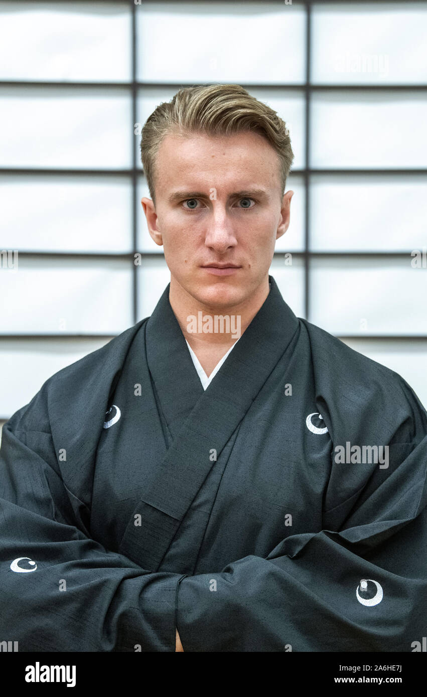 Munich, Germany. 23rd Oct, 2019. Otsuka Ryousuke Taira no Masatomo, Markus Lösch, grandmaster of a samurai school, stands in his 'Chiba-Dojo' in front of a Japanese paper wall (Shoji). Otsuka was adopted by a samurai family whose roots go back 800 years. Credit: Lino Mirgeler/dpa/Alamy Live News Stock Photo