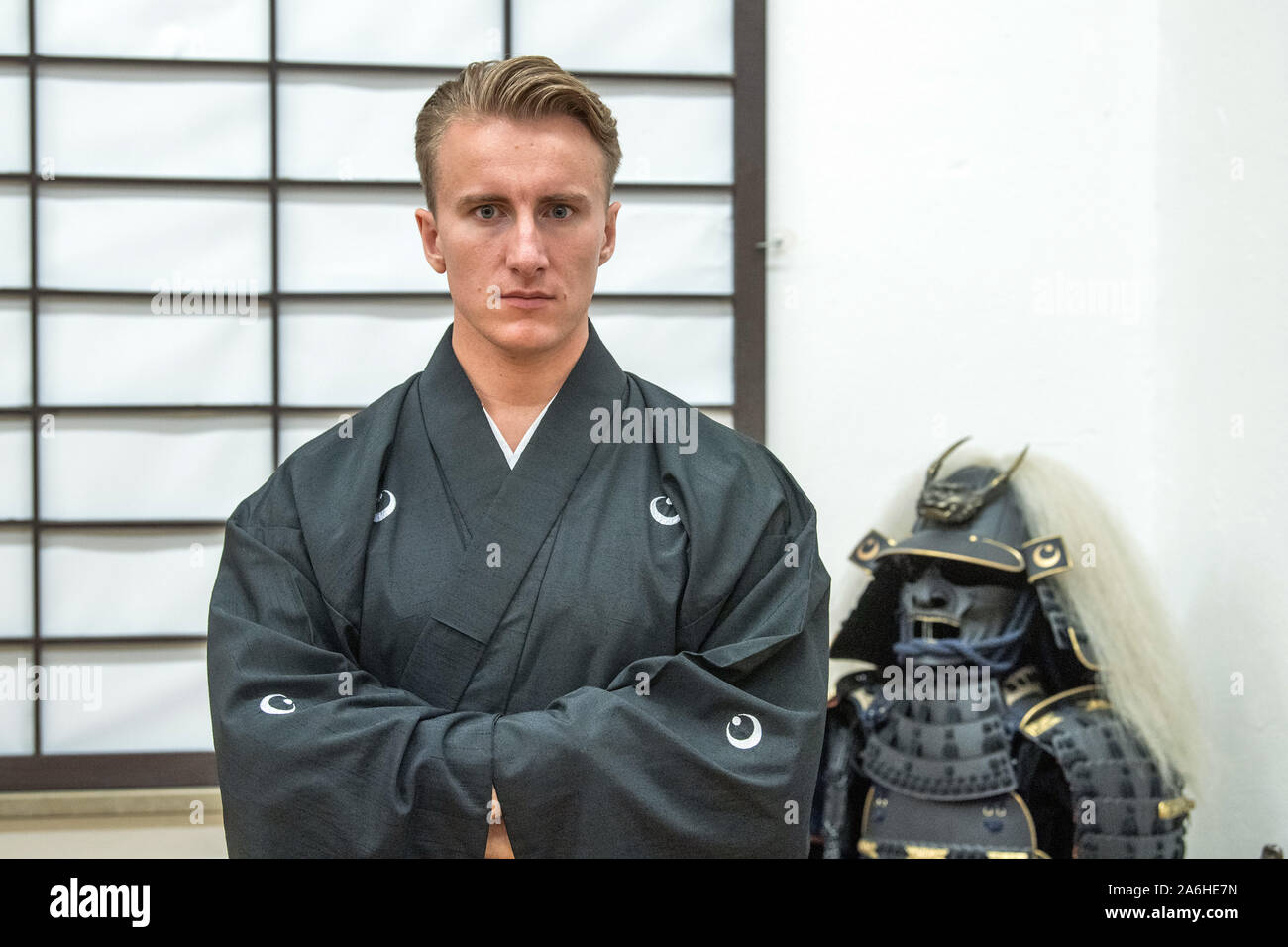 Munich, Germany. 23rd Oct, 2019. Otsuka Ryousuke Taira no Masatomo, Markus Lösch, grandmaster of a samurai school, stands in his 'Chiba-Dojo' in front of a Japanese paper wall (Shoji). Otsuka was adopted by a samurai family whose roots go back 800 years. Credit: Lino Mirgeler/dpa/Alamy Live News Stock Photo
