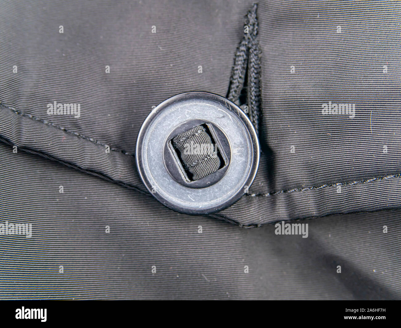 A large button on clothes. Clothing. Stock Photo