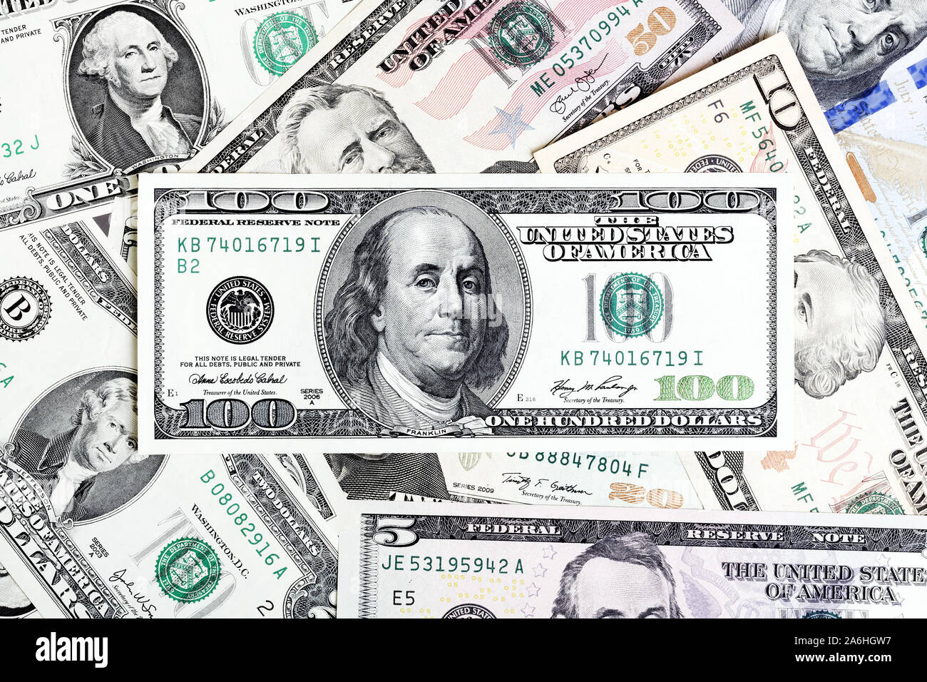 Two American dollar bill with money on background close up. Stock Photo