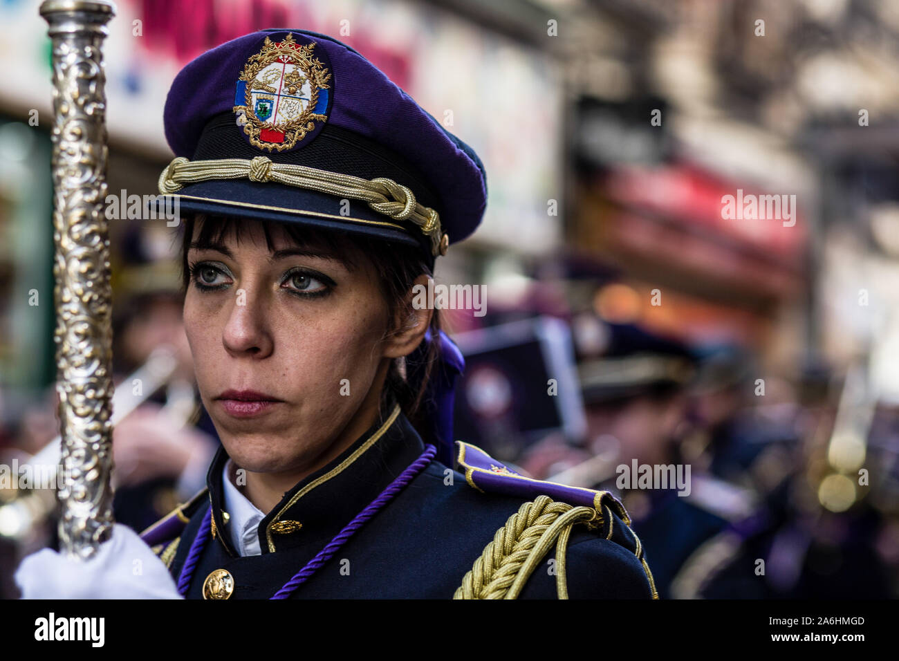 A Catholic parishioner during the procession. Virgin Almudena procession happens through the streets of Madrid where the saint patron of the capital of Spain is carried from Plaza Mayor to Almudena's Cathedral. Hundreds of catholic congregations join the procession to honour the virgin. Stock Photo