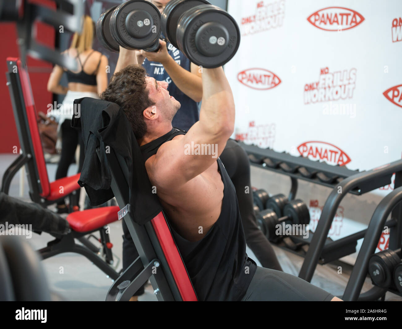Boy at Gym doing Weightlifting Exercises Fitness Workout on Bench
