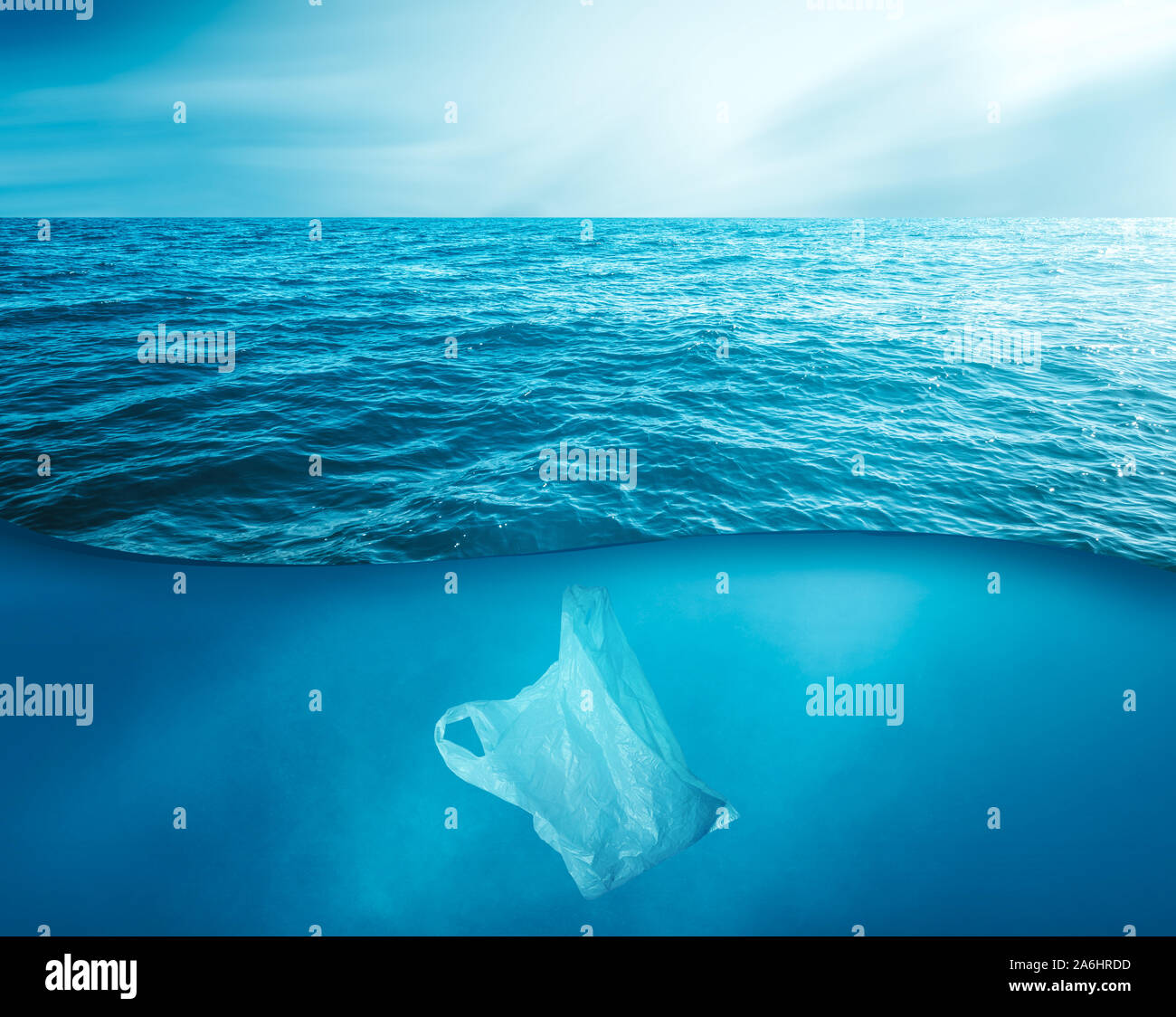 a discarded plastic rubbish bag floats underwater on a presenting a hazard to all marine life. Stock Photo