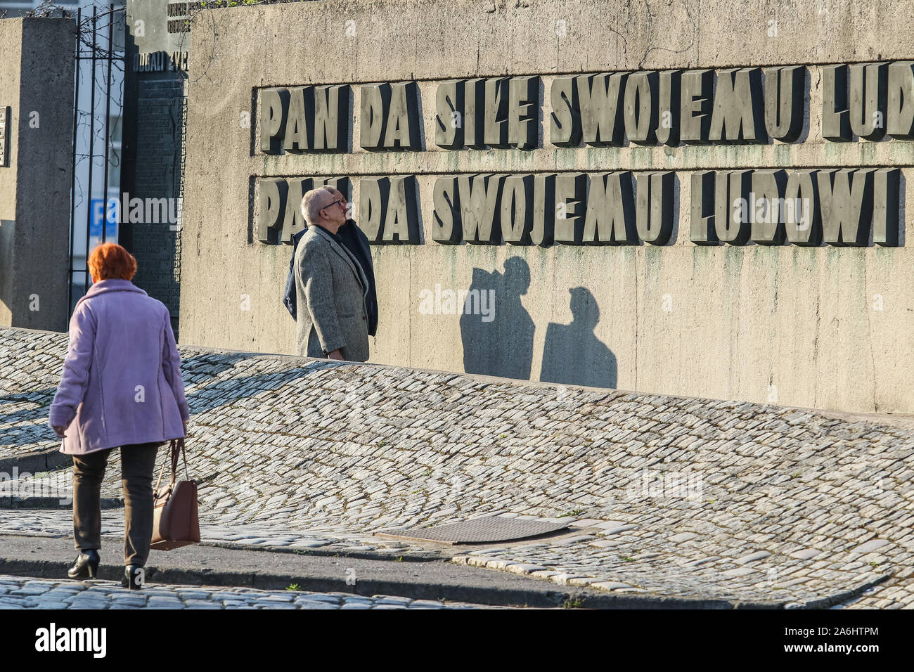 People walking at the Solidarity Square in front of historical Gdansk Shipyard, now the European Solidarity Centre Museum building  is seen in Gdansk, Poland on 6 April 2019  © Michal Fludra / Alamy Live News Stock Photo