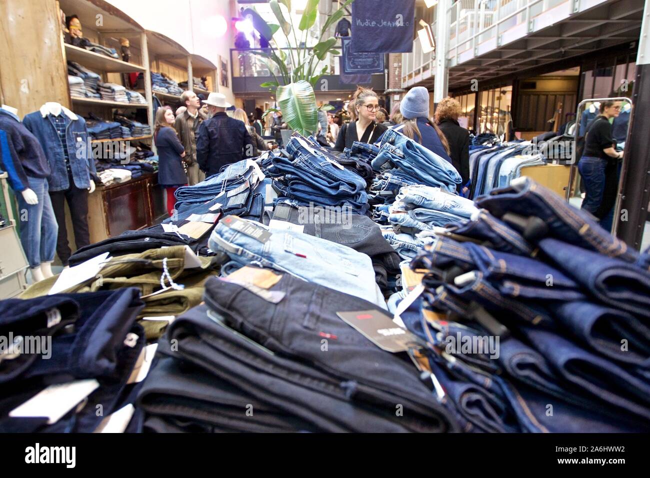 Amsterdam, Netherlands. 26th Oct, 2019. Visitors view jeans during the Amsterdam  Denim Days in Amsterdam, the Netherlands, Oct. 26, 2019. The Amsterdam Denim  Days 2019 was held from Oct. 22-27 in the