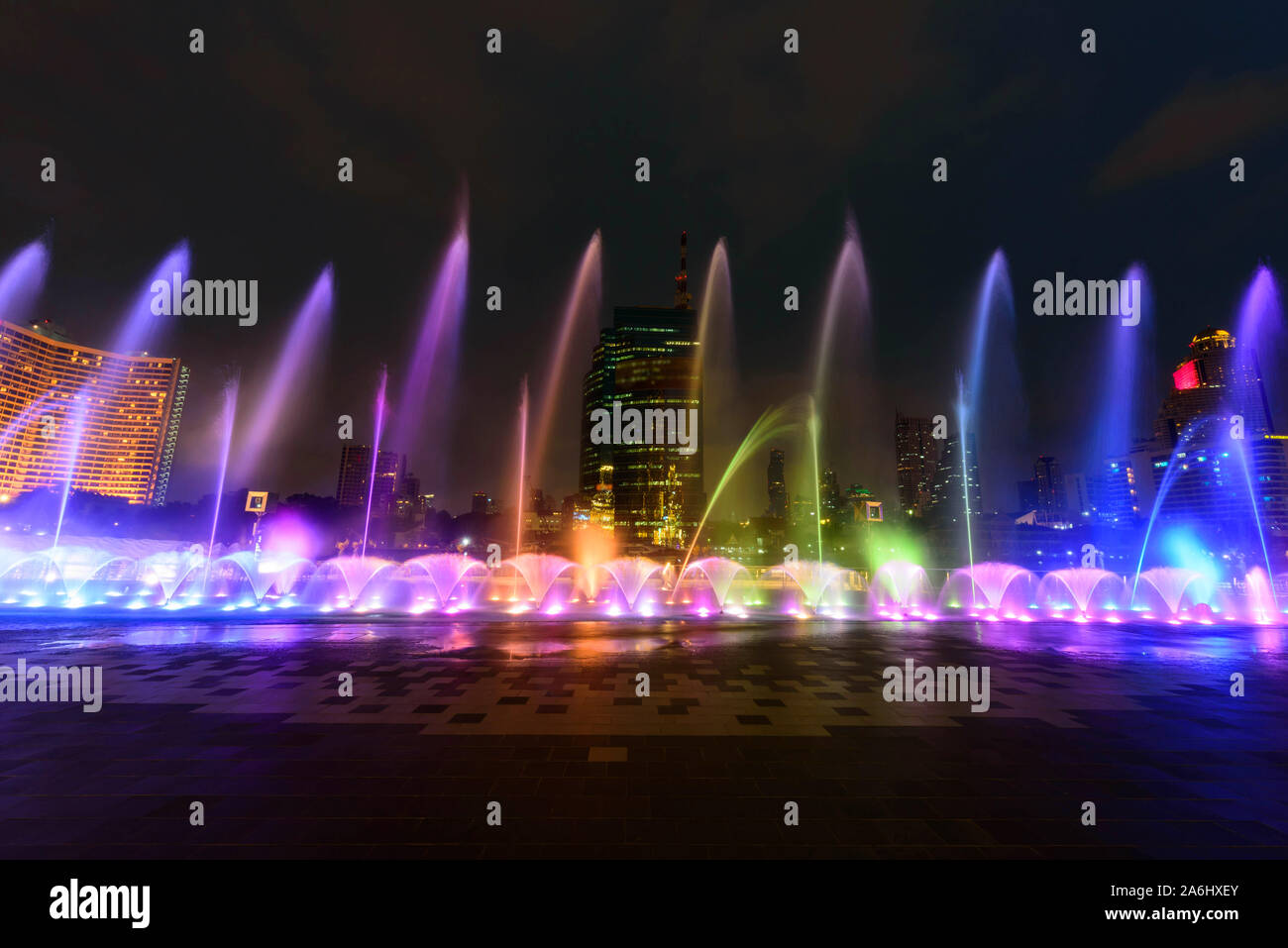 the fountain showing with lighting in night time Stock Photo - Alamy