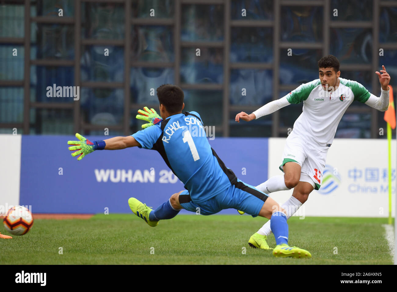 Wuhan, China. 27th Oct, 2019. Goalkeeper Ri Chol Song (L) of the Democratic People's Republic of Korea (DPRK) makes a save during the men's football bronze medal match between Algeria and the DPRK at the 7th International Military Sports Council (CISM) Military World Games in Wuhan, capital of central China, Oct. 27, 2019. Credit: Li Ga/Xinhua/Alamy Live News Stock Photo