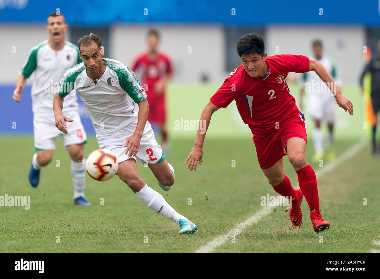 Wuhan, China. 27th Oct, 2019. Zakaria Khali (L) of Algeria vies with Pak  Kwang Chon of the Democratic People's Republic of Korea (DPRK) during the  men's football bronze medal match between Algeria