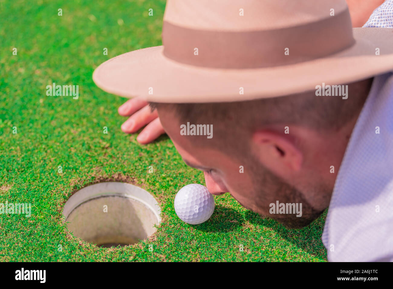 golf hat with ball on top