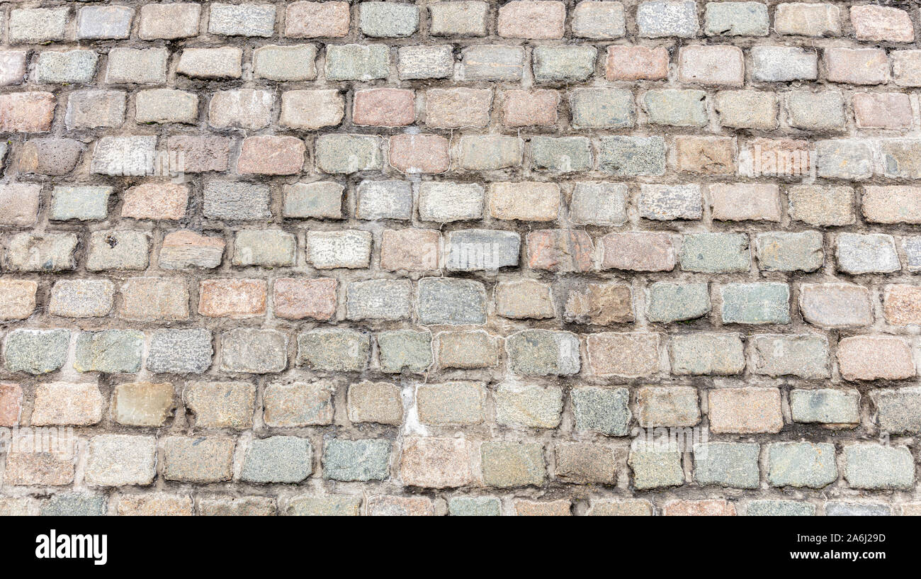 Gray color stones structure, stonewall building facade background, texture Stock Photo