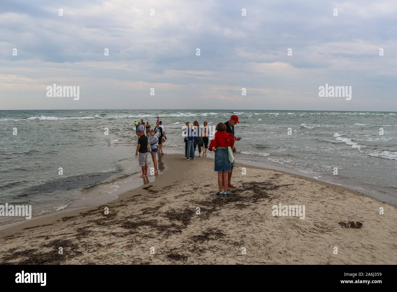 Grenen the point where the North Sea and the Baltic sea collide is seen in Skagen, Denmark on 28 July 2019 People visit the place and stand with one leg in each sea, watching the waves arriving from each direction until, finally, they meet. © Michal Fludra / Alamy Live News Stock Photo