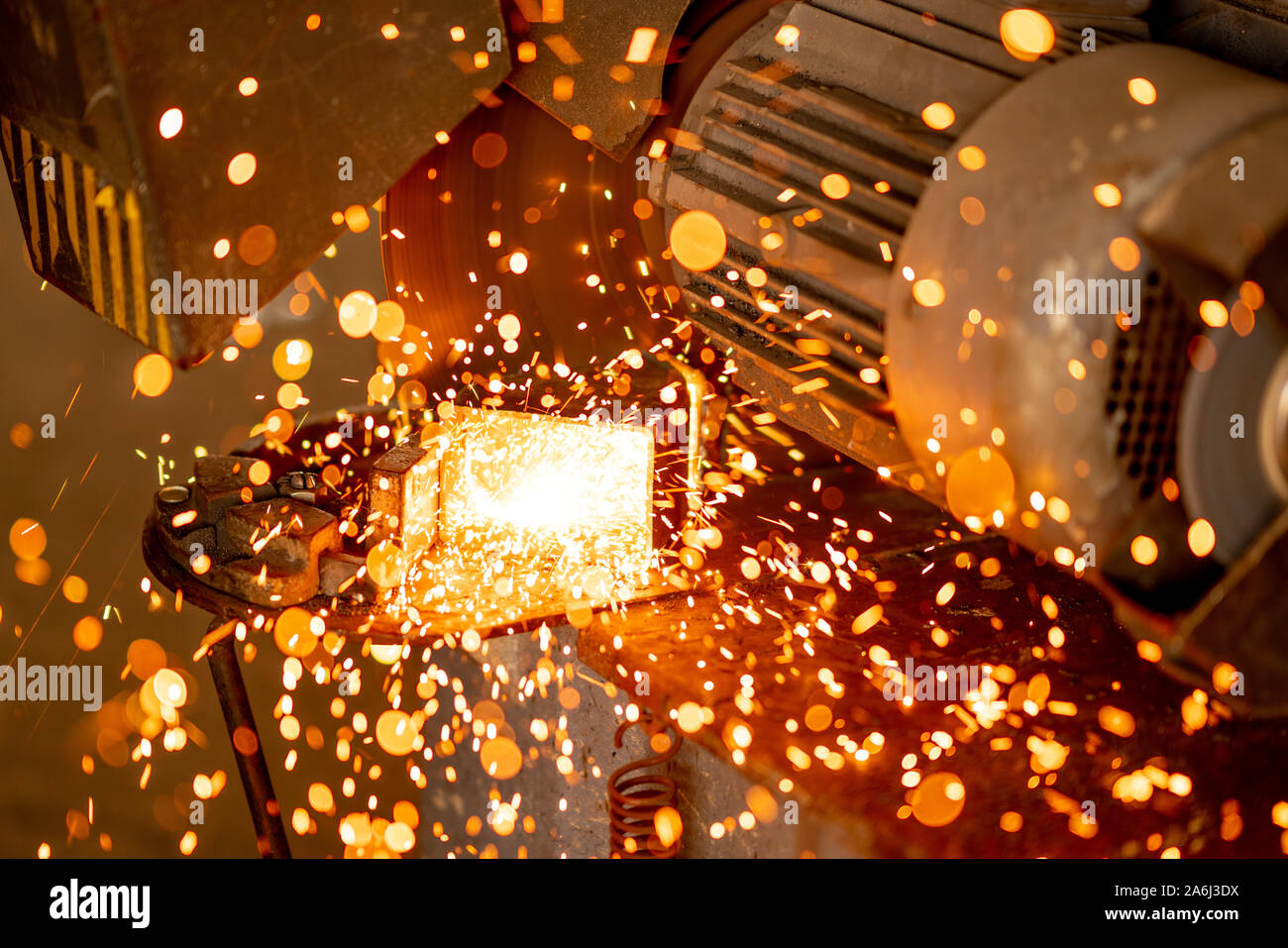 Cutting industrial metal with grinder. Sparks while grinding iron. Stock Photo