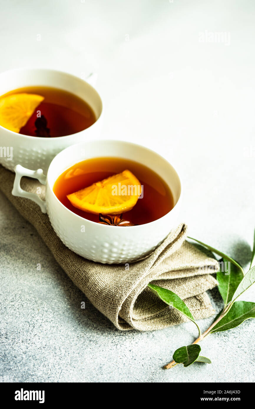 Mulled tea with lemon and spices on stone table with copy space Stock ...