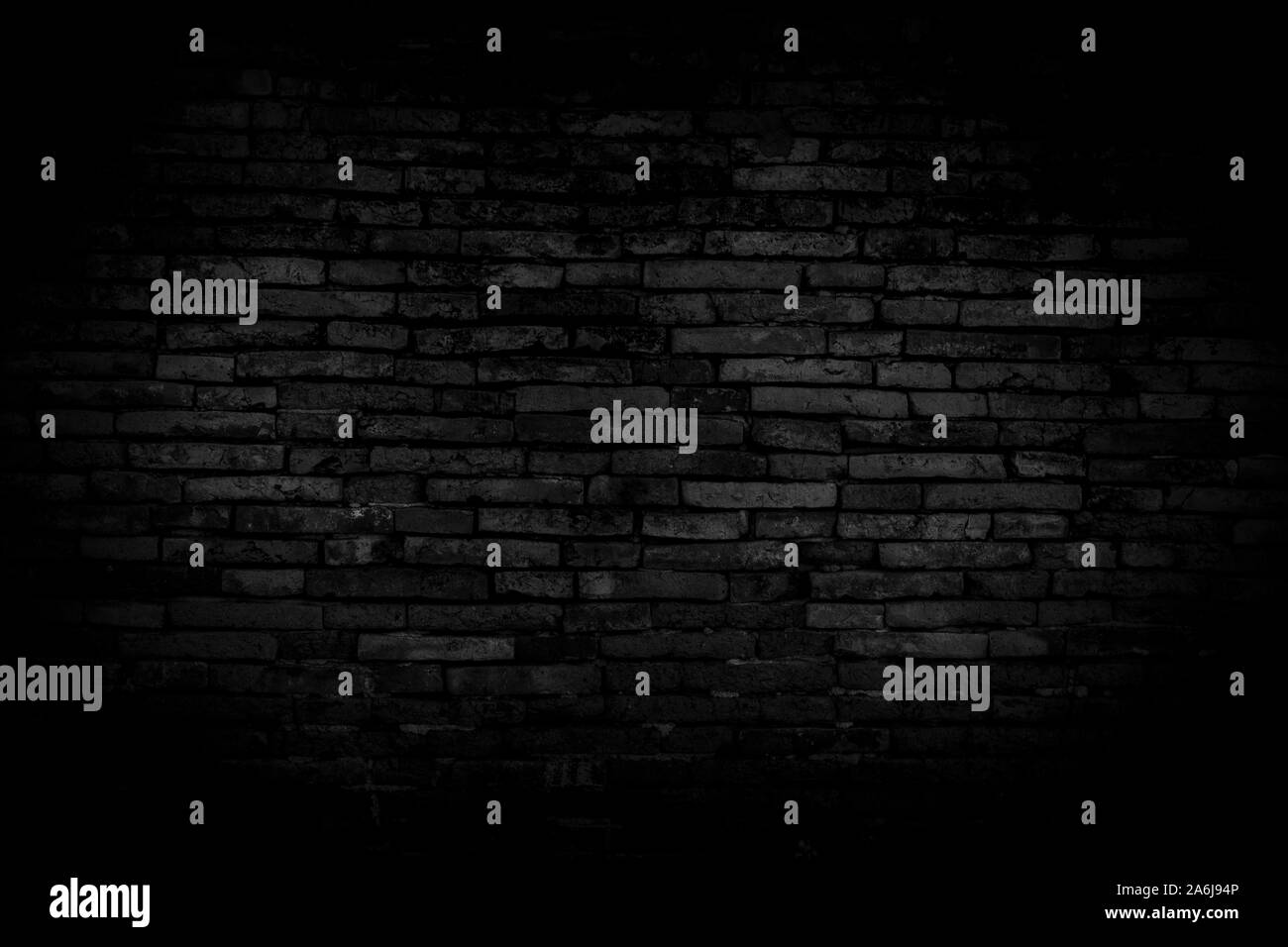 Black brick walls background and texture. The texture of the brick is black. Background of empty brick basement wall. black wall. Stock Photo