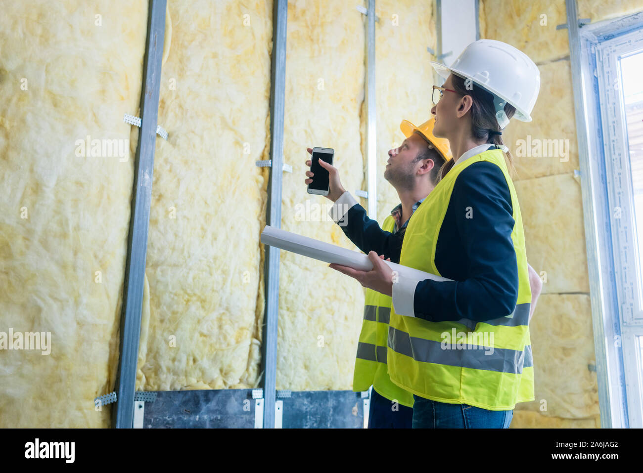 Construction manager and architect checking the insulation works Stock Photo