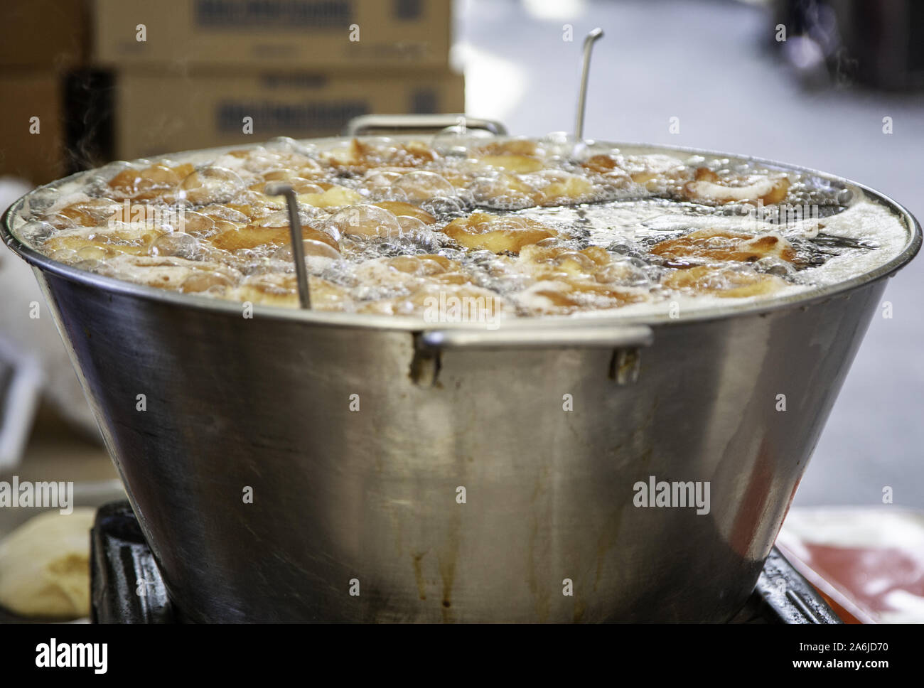 Frying donuts in oil, sweet dessert detail, homemade pastries, sugar