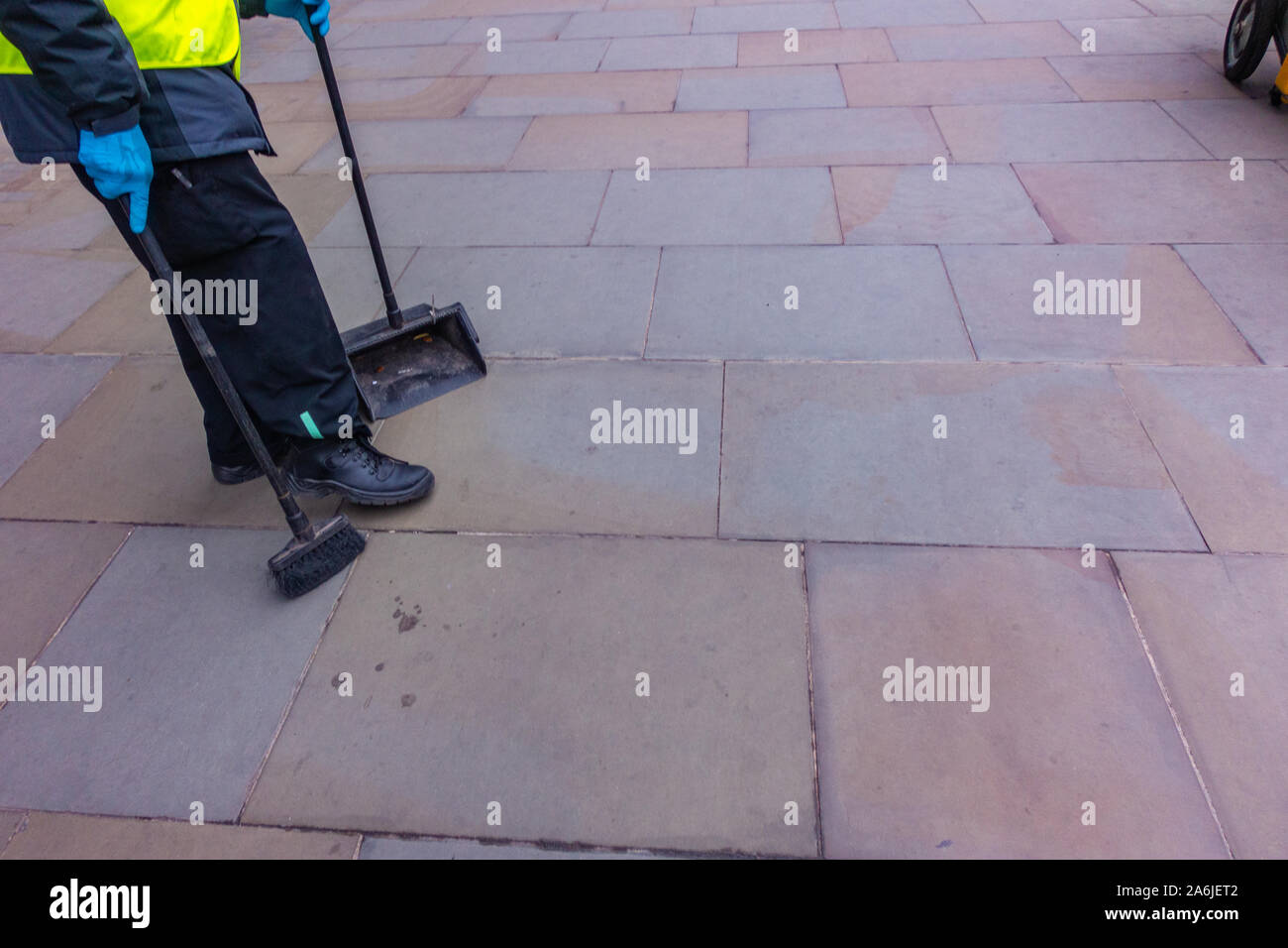 Bottom half of street cleaner doing his job on London Streets Stock