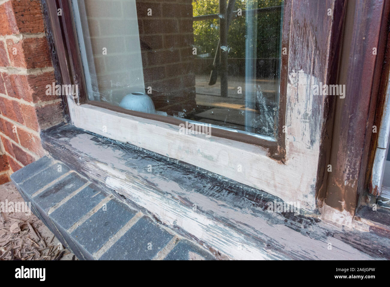 Exterior timber window repair: view after resin has dried (see 2A6JGP9 for initial resin repair and 2A6JJW0 for fully repaired and painted) Stock Photo
