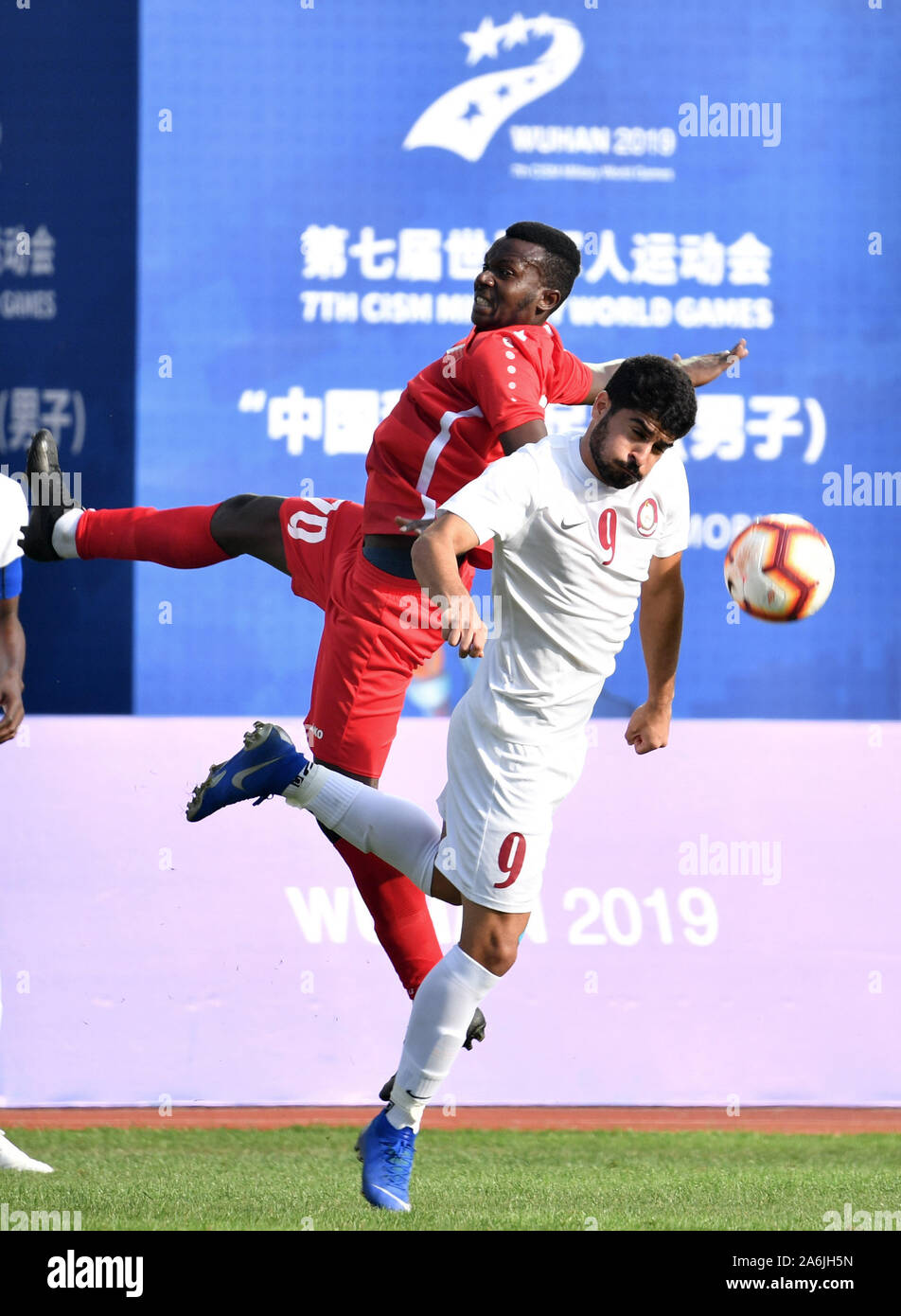 Wuhan, China. 27th Oct, 2019. Saoud Farhan Ishbaih (R) of Qatar vies with  Yahiya Infahi of Bahrain during the men's football final match between  Qatar and Bahrain at the 7th International Military