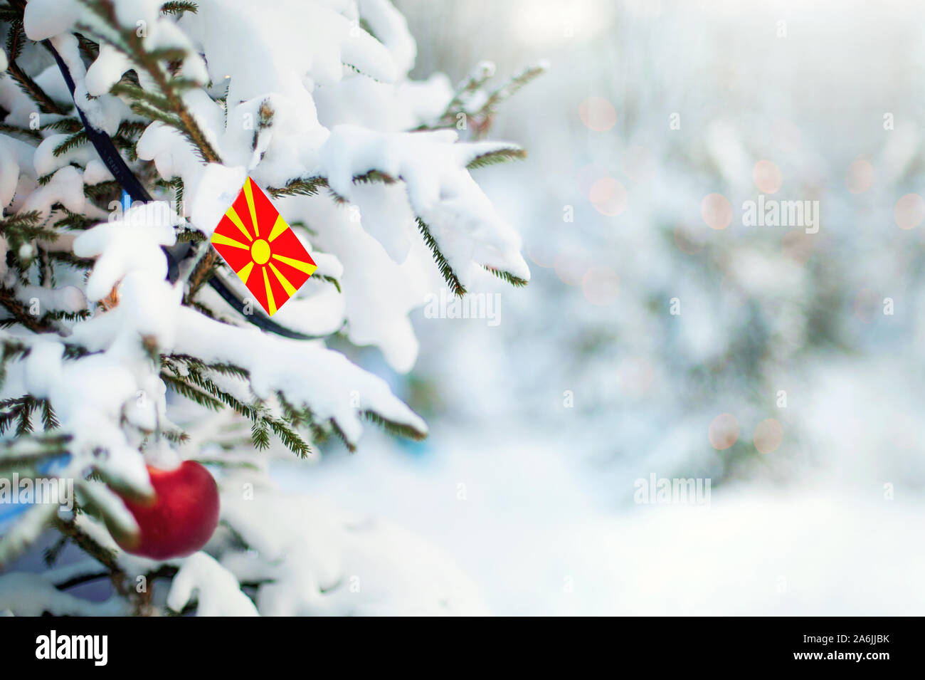Christmas Macedonia. Xmas tree covered with snow, decorations and a