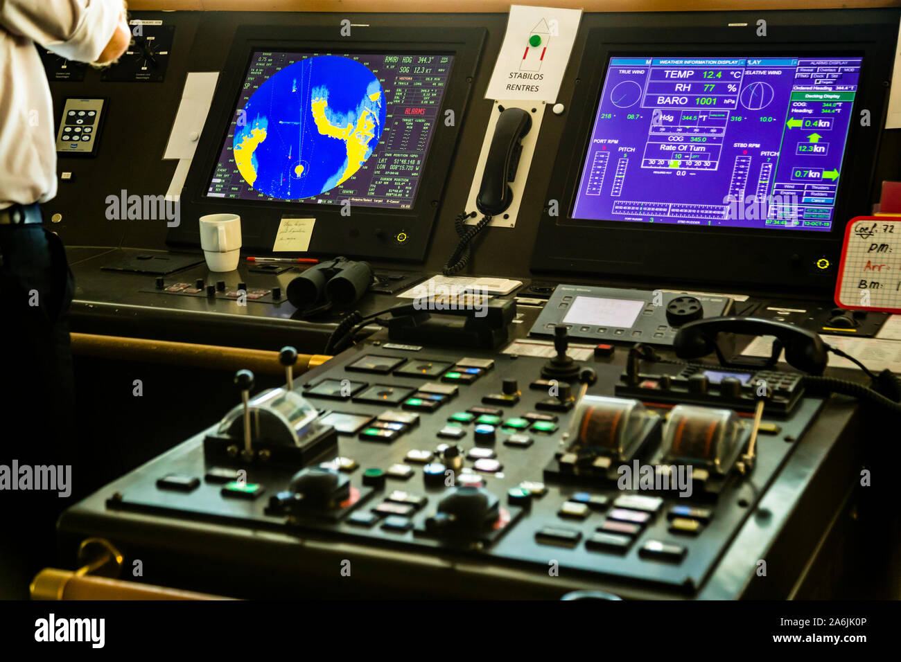 Radar and weather displays glow on the screens of the bridge of the Pont Aven of Brittany Ferries. The photograph was taken as the ferry entered the port of Cork near Weaver's Point, Ireland. Stock Photo