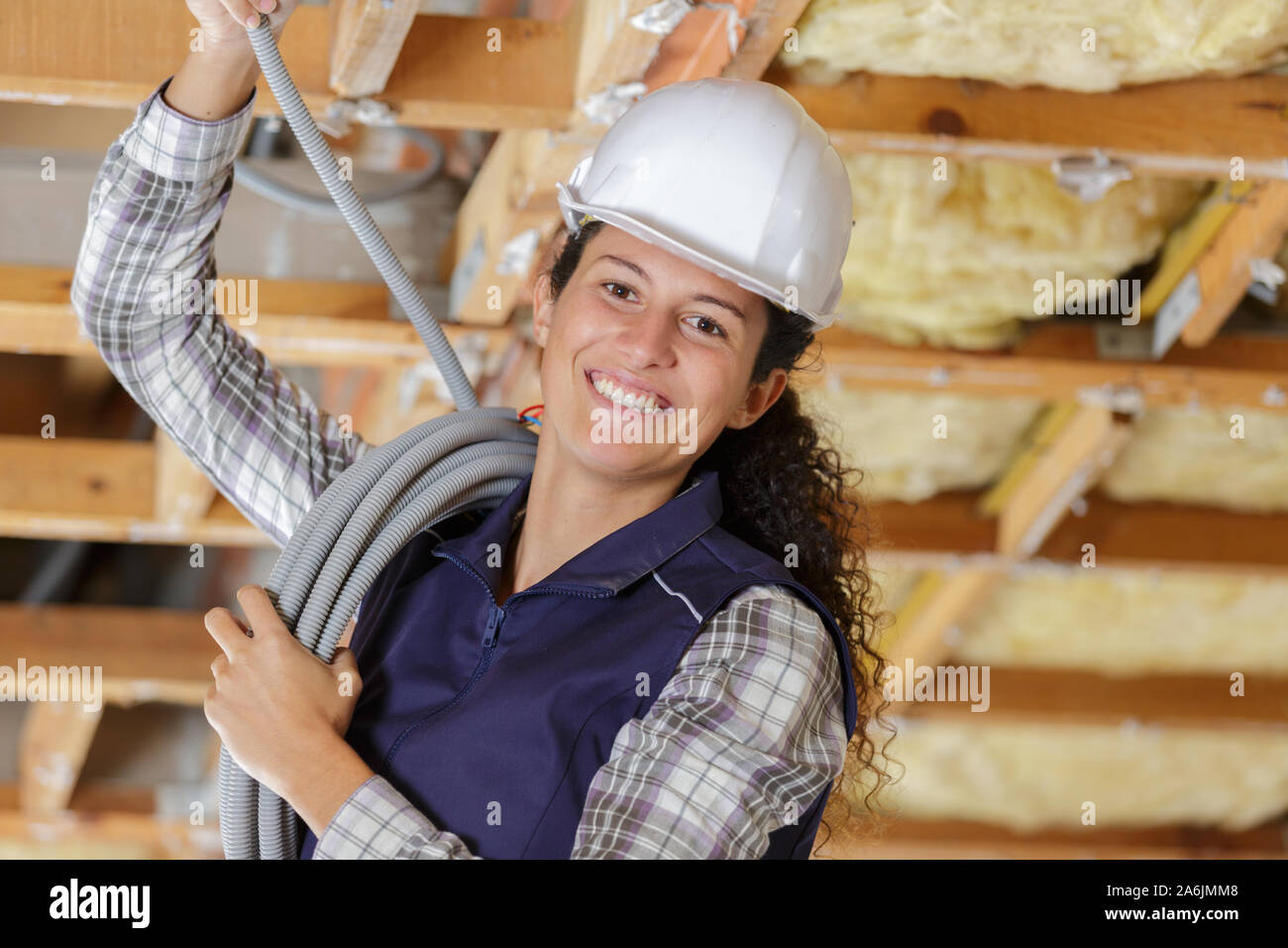 builder covering an electrical wire Stock Photo Alamy