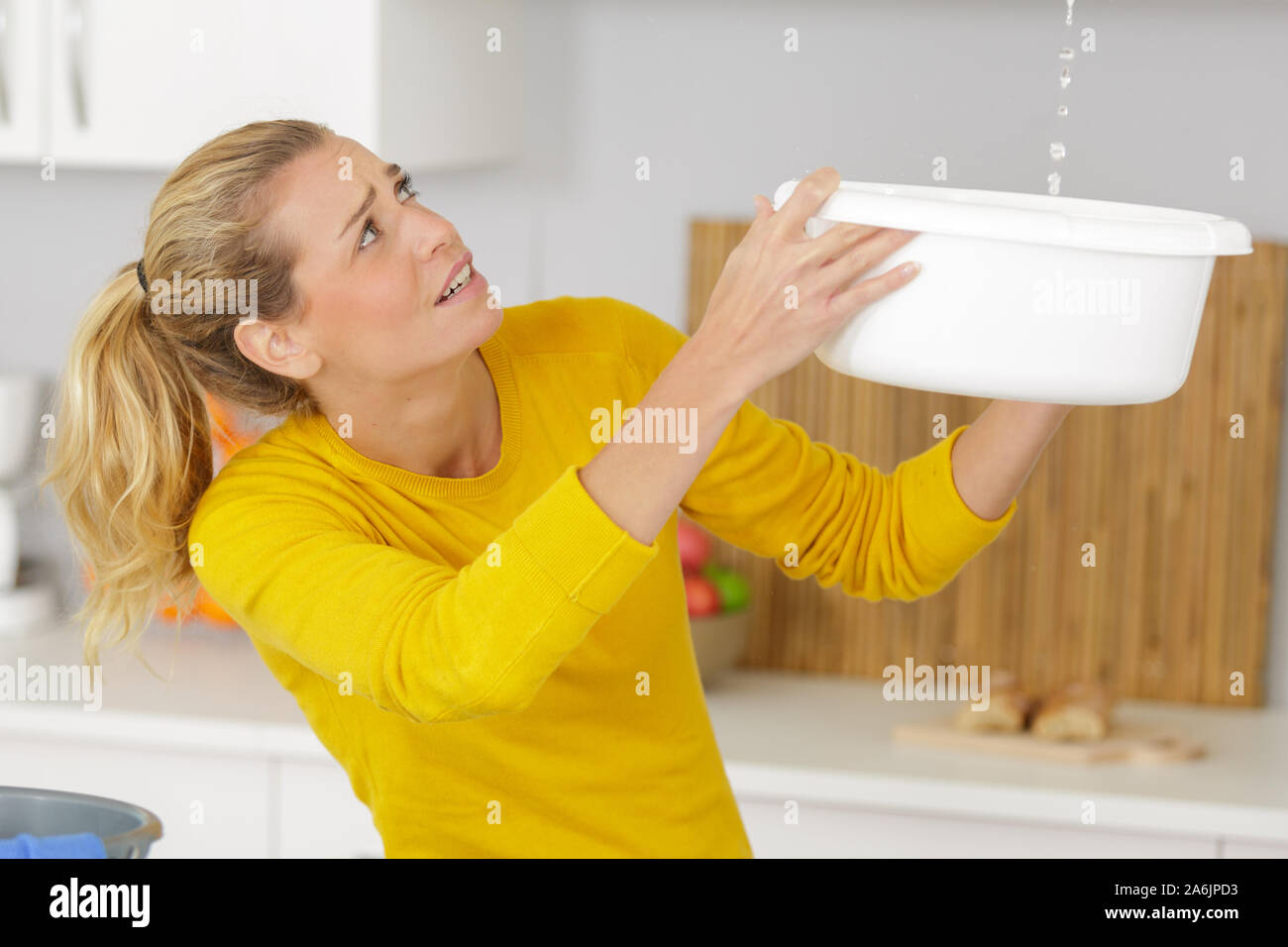 Girl collecting water in bucket hires stock photography and images Alamy