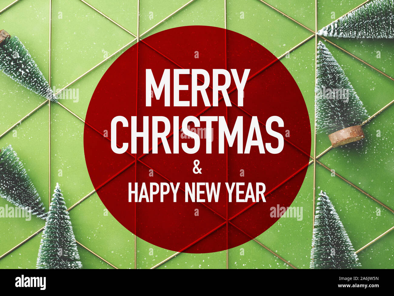 Merry Christmas and Happy New Year in red circle with green christman tree on  green lime background with snow falling.holiday celebration greeting ca Stock Photo