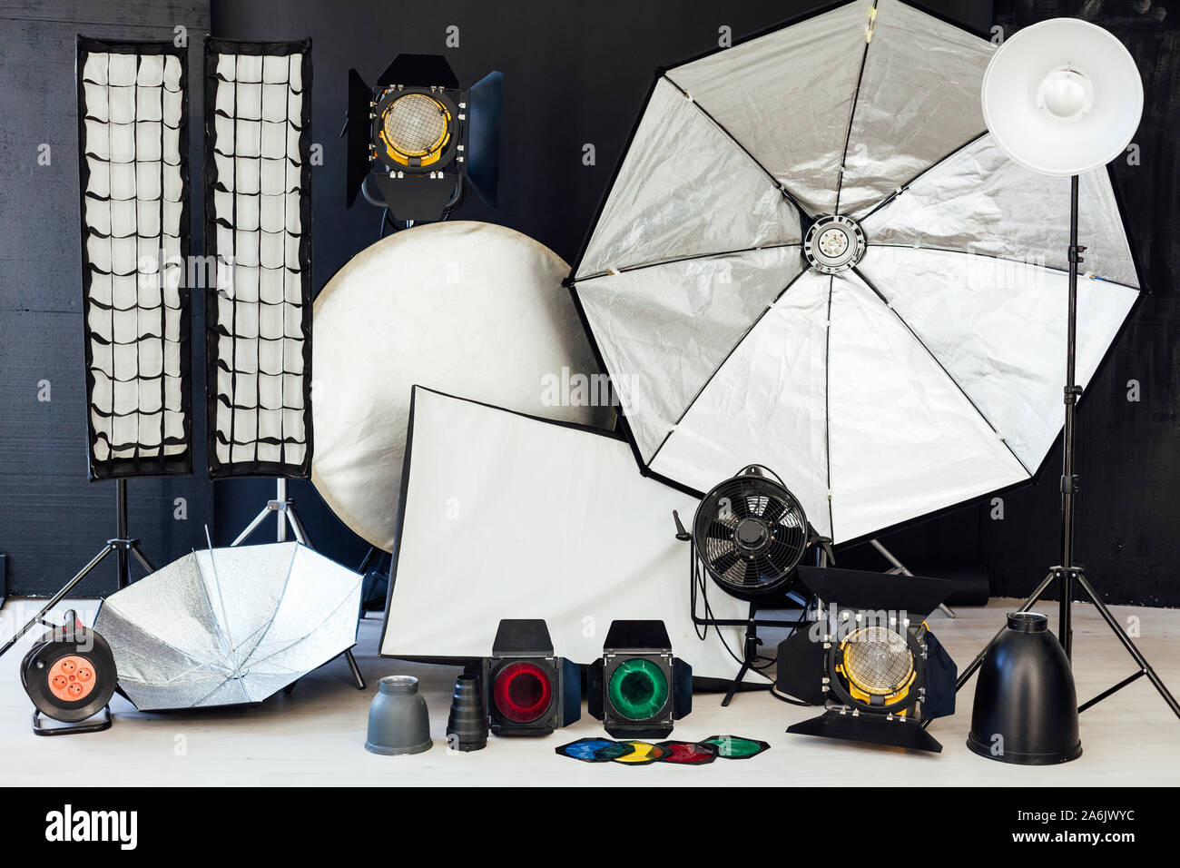 Photo studio equipment flash accessories photographer on black