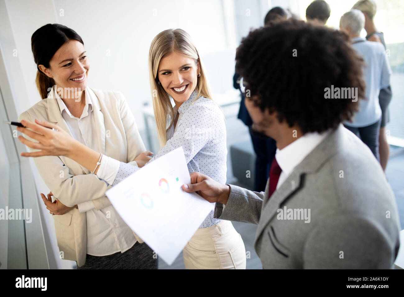 Group of business people discussing, brainstorming in office ...