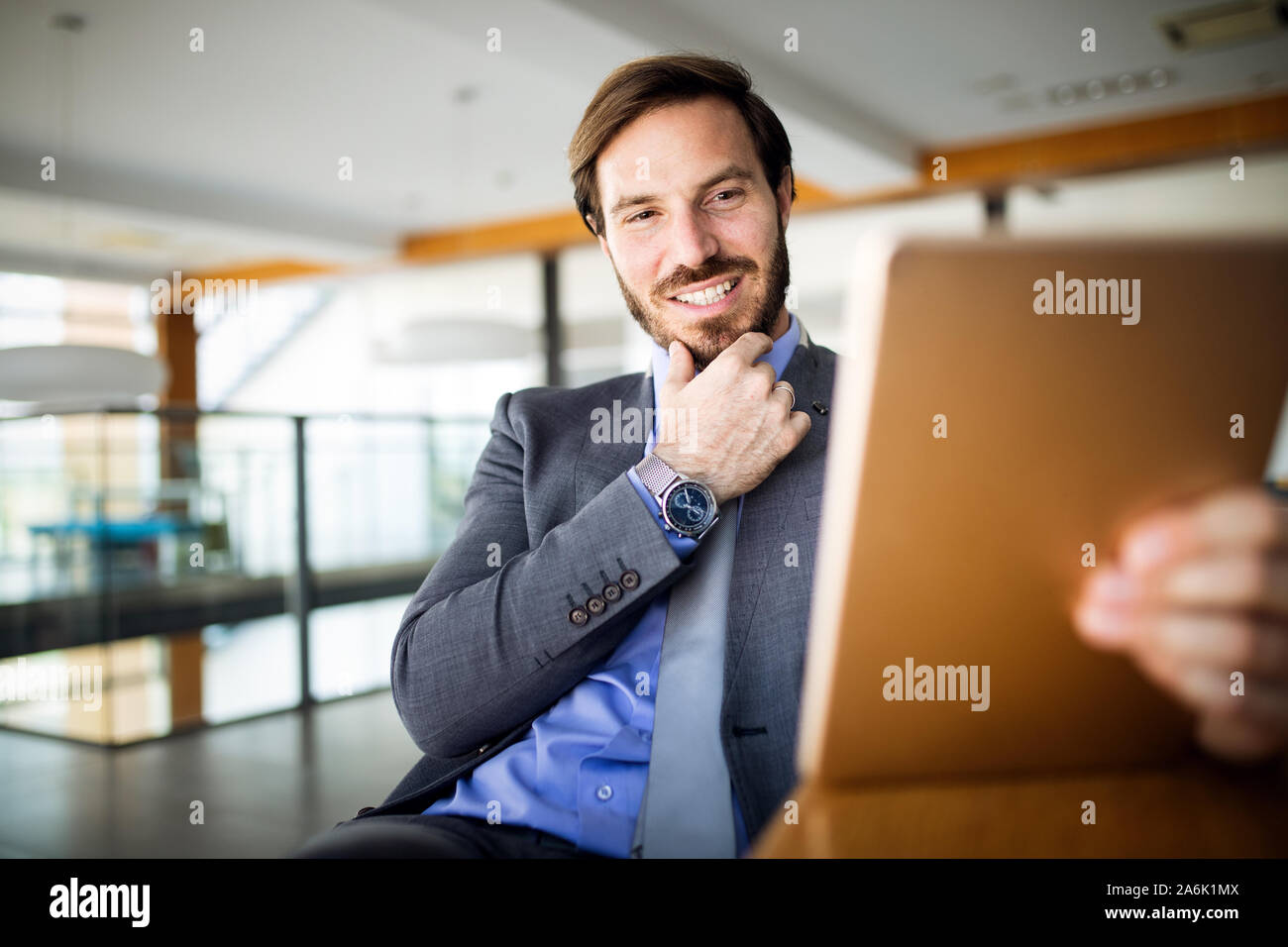 Elegant business multitasking multimedia man using devices Stock Photo