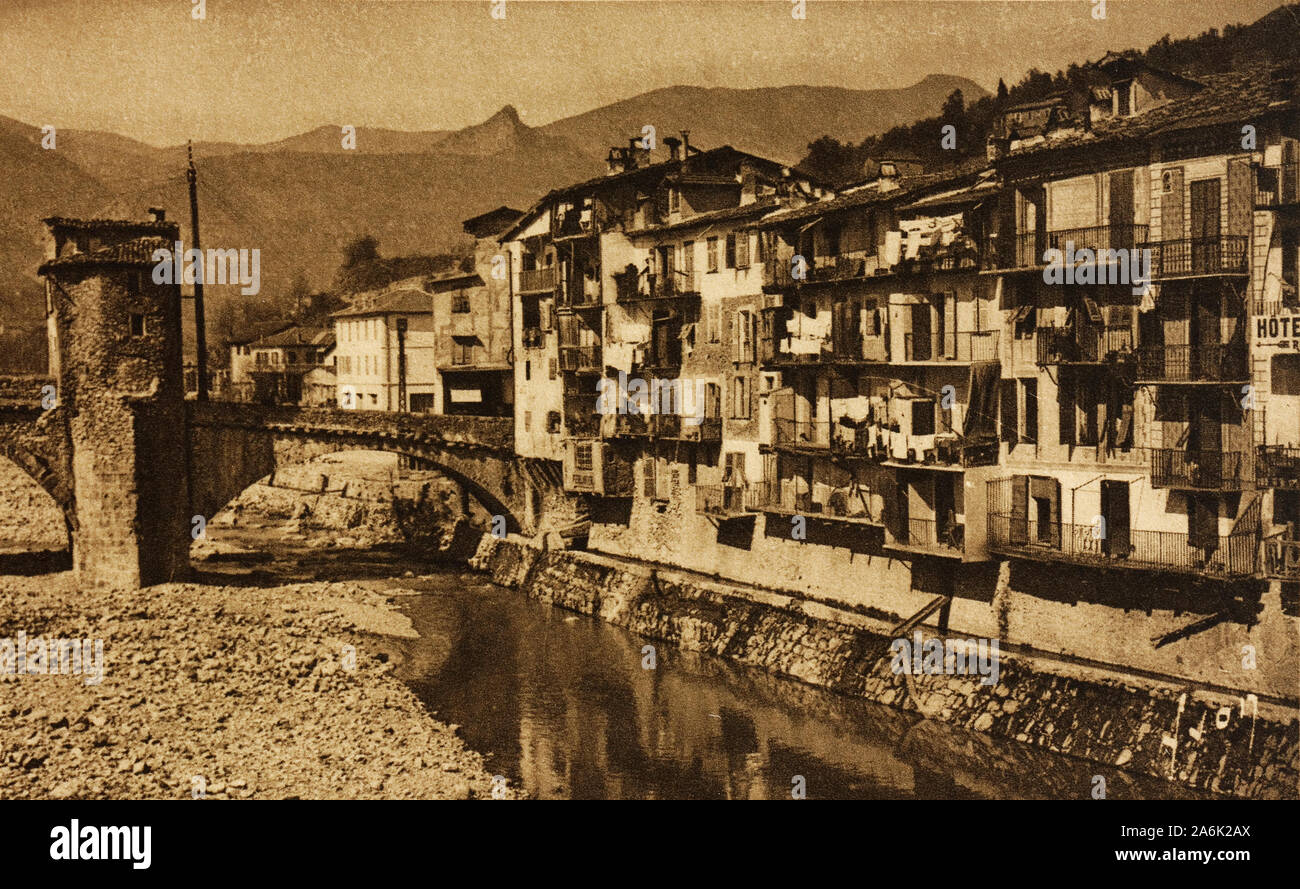 Old postcard image of houses on the Bévéra river in Sospel, Alpes-Maritime, France Stock Photo