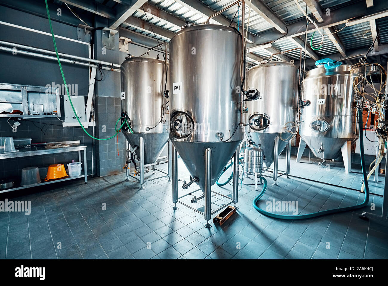 Fermantation mash vats or boiler tanks in a brewery factory. Brewery plant interior. Stock Photo