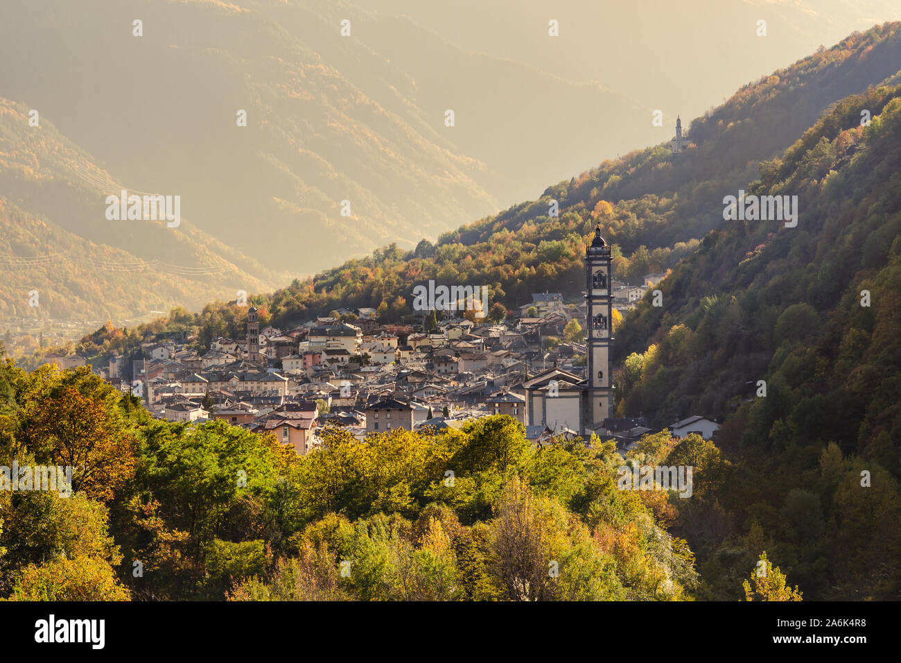 The small town of Grosotto, located in the Valtellina valley in the Alps, in northern Italy, on a sunny autumn afternoon Stock Photo