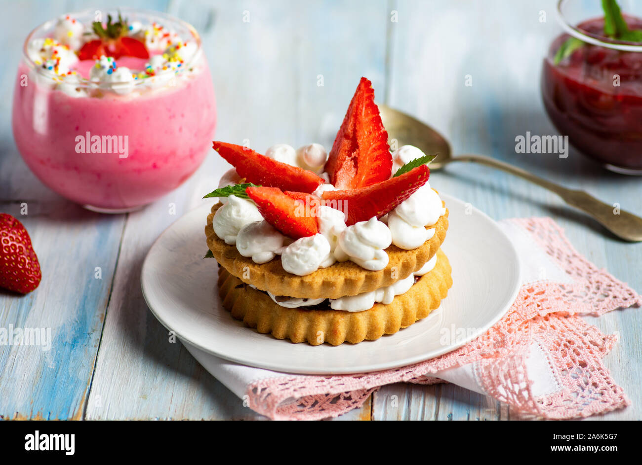 Homemade strawberry dessert with sweet cream in a cup Stock Photo