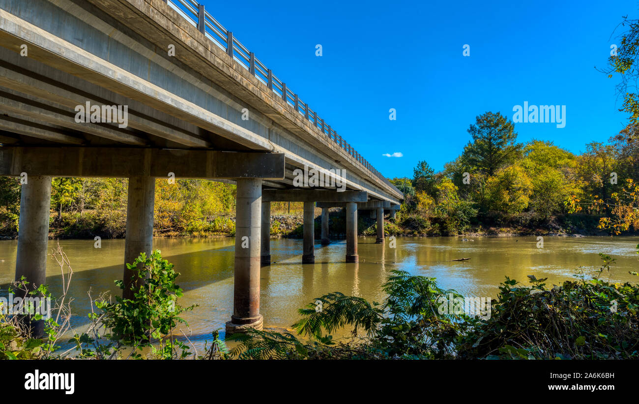 Highway bridge crossing Haw River at Swepsonvile River Park with early