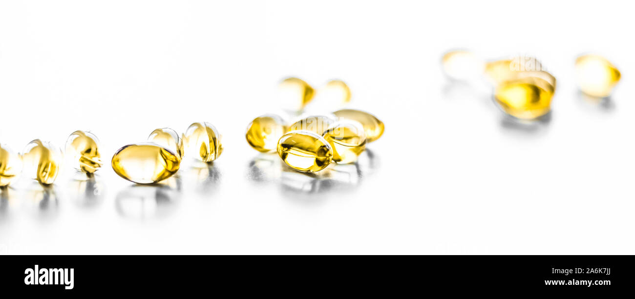 Pharmaceutical, branding and science concept -  Vitamin D and golden Omega 3 pills for healthy diet nutrition, fish oil food supplement pill capsules, Stock Photo