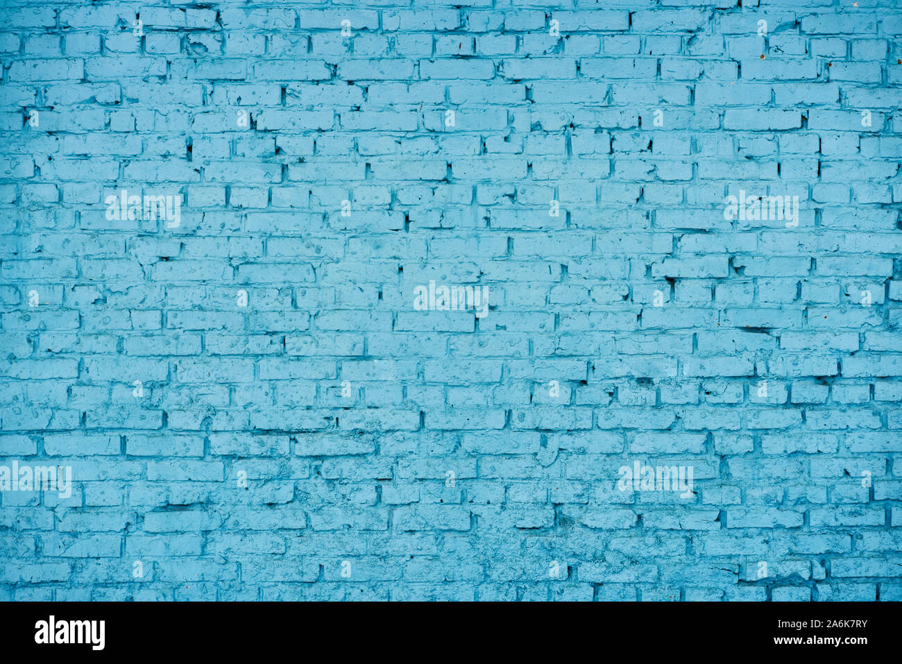 old red brick Brick wall painted with deep blue paint Stock Photo
