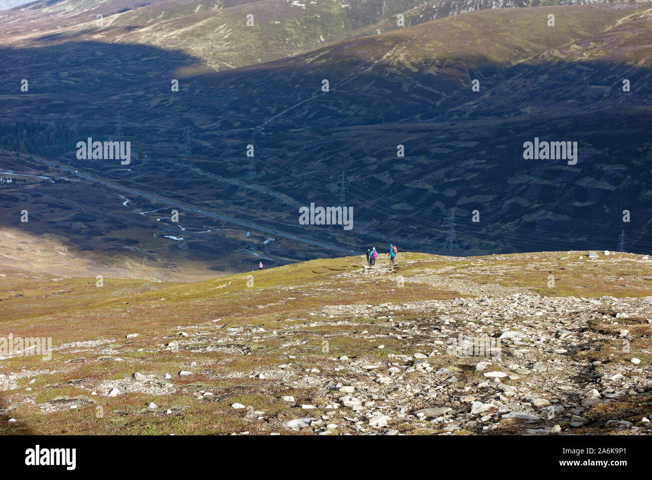 Hillwalkers descend A'Mharconaich Stock Photo