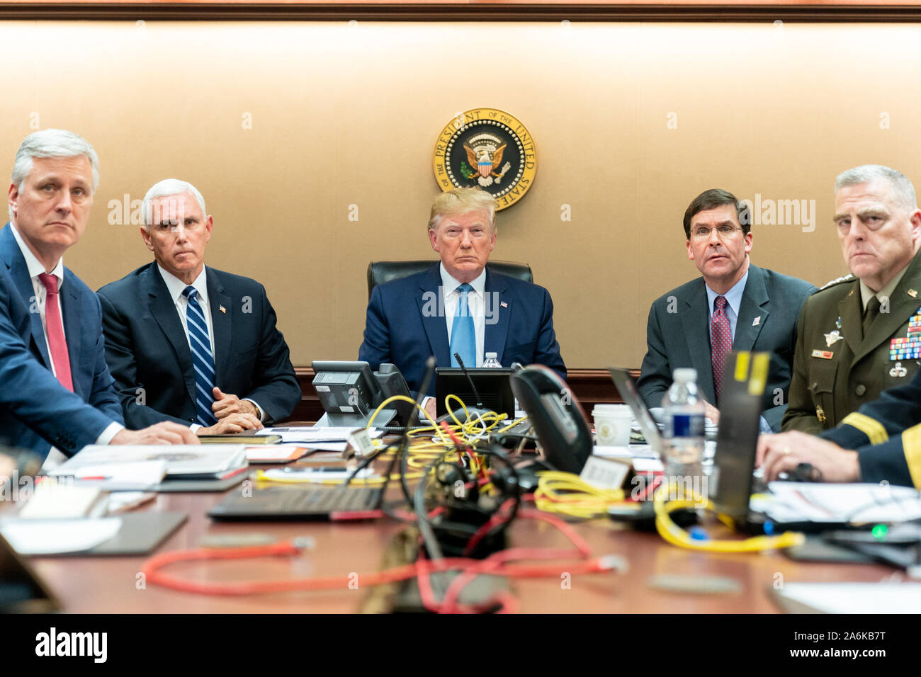 Washington DC, USA. 26th Oct, 2019. In this photo released by the White House, United States President Donald J. Trump is joined by United States Vice President Mike Pence, United States National Security Advisor Robert C. O'Brien, left; United States Secretary of Defense Dr. Mark T. Esper and United States Army General Mark A. Milley, Chairman of the Joint Chiefs of Staff, right, Saturday, October 26, 2019, in the Situation Room of the White House in Washington, DC monitoring developments as U.S. Special Operations forces close in on ISIS leader Abu Bakr al-Baghdadi's compound in Syria with a Stock Photo