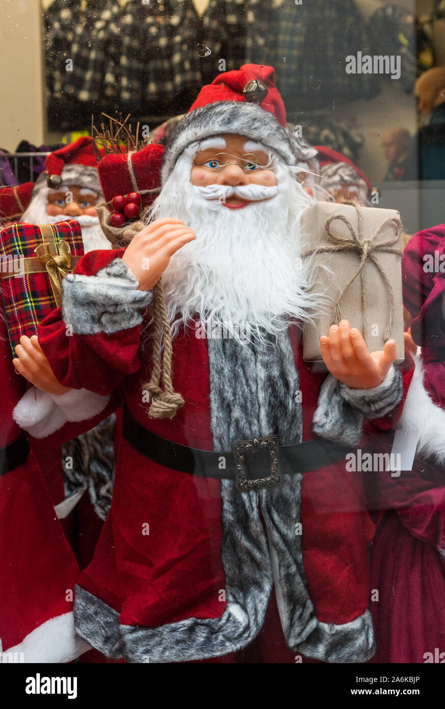 Cork City, Cork, Ireland. 25th October, 2019. Department Store window filled with Santa Claus dolls in Oliver Plunkett Street, Cork, Ireland. - Credit Stock Photo