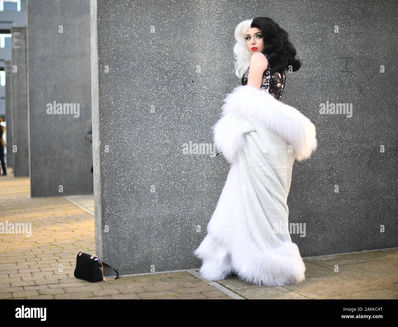 A cosplayer dressed as Cruella de Vil during the third day of MCM Comic Con at the ExCel London in east London. Stock Photo